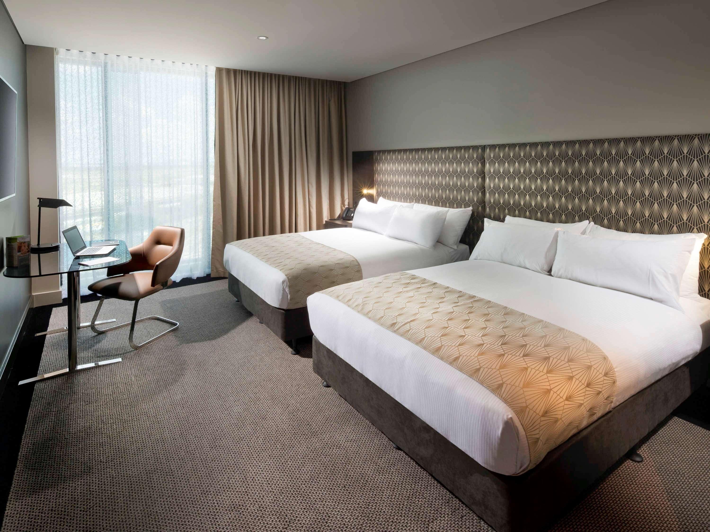 Hotel Pullman Brisbane Airport Exterior foto A room at the hotel